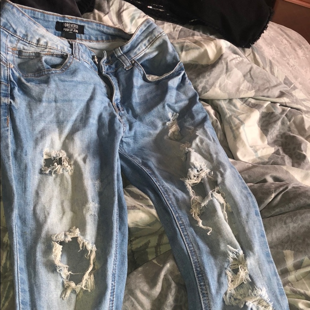 Damaged fashionable jeans